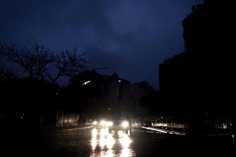 Cars drive through an unlit street during a blackout in Buenos Aires, Argentina, Sunday, June. 16, 2019. A massive blackout left tens of millions of people without electricity in Argentina, Uruguay and Paraguay on Sunday in what the Argentine president called an “unprecedented” failure in the countries’ power grid. (AP Photo/Tomas F. Cuesta)