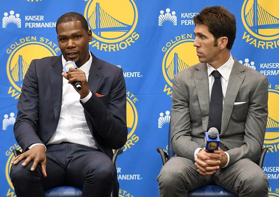 OAKLAND, CA - JULY 07: (LR) Head coach Steve Kerr of the Golden State Warriors sits with Kevin Durant and general manager Bob Myers while they speak to the media during the press conference where Durant was introduced as a Golden State Warrior after they signed him as a free agent on July 7, 2016 in Oakland, California.  (Photo by Thearon W. Henderson/Getty Images)