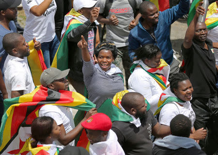 Protesters march calling for Zimbabwean President Robert Mugabe to step down in Cape Town, South Africa, November 18, 2017. REUTERS/Sumaya Hisham