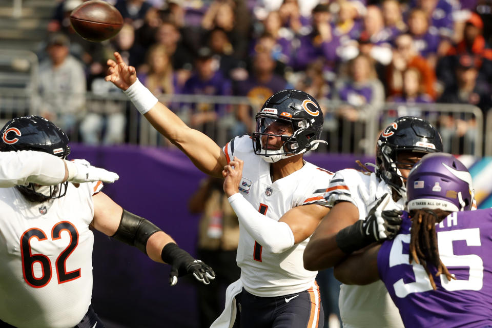 Chicago Bears quarterback Justin Fields (1) isn't throwing very often this season. (AP Photo/Bruce Kluckhohn)