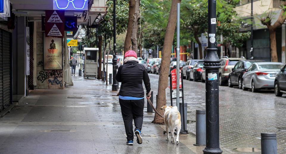 Woman walks her dog in Beirut, Lebanon. Source: AP