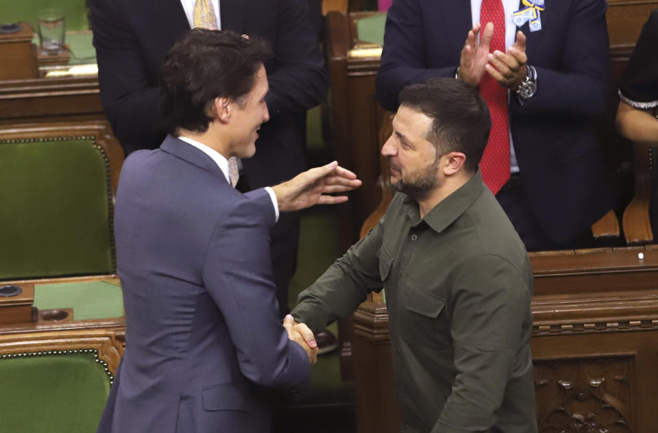 Ukrainian President Volodymyr Zelenskyy and Prime Minister Justin Trudeau embrace after delivering a speech in the House of Commons on Parliament Hill in Ottawa on Friday, Sept. 22, 2023. (Patrick Doyle/The Canadian Press via AP)