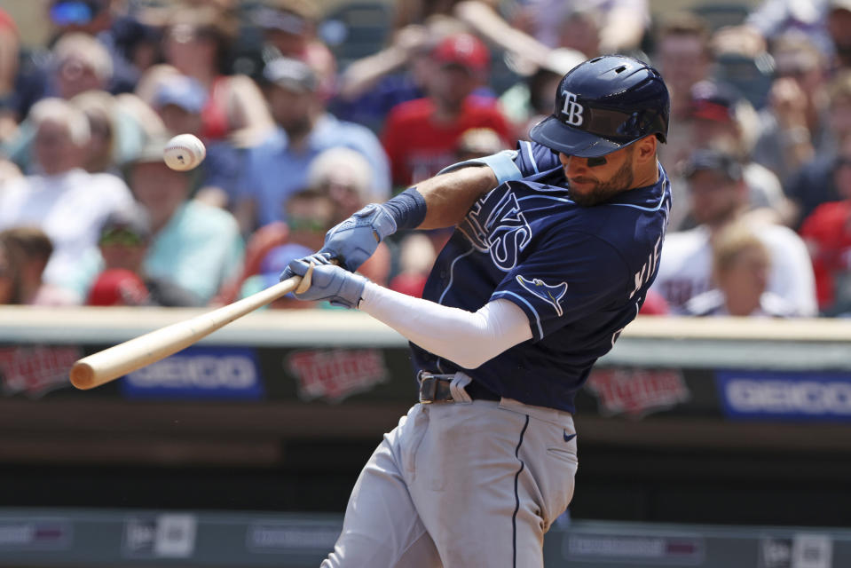 Tampa Bay Rays' Kevin Kiermaier hits a single during the fifth inning of a baseball game against the Tampa Bay Rays, Sunday, June 12, 2022, in Minneapolis. (AP Photo/Stacy Bengs)