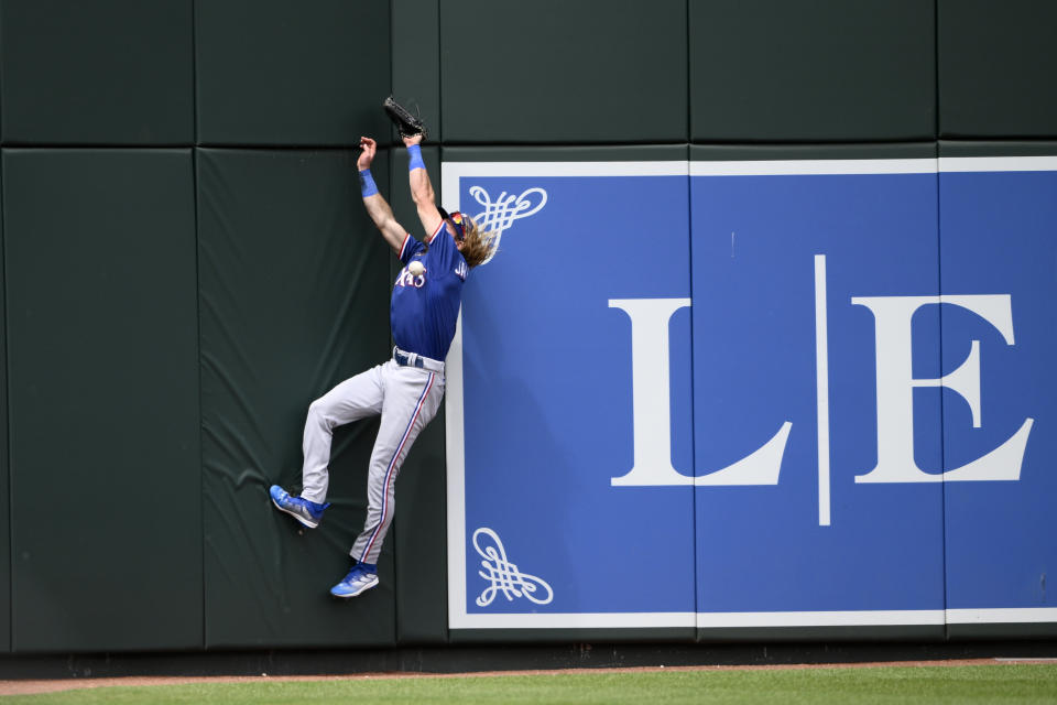 Texas Rangers left fielder Travis Jankowski cannot get a ball that went for a triple for Baltimore Orioles' Austin Hays during the third inning of a baseball game, Sunday, May 28, 2023, in Baltimore. (AP Photo/Nick Wass)