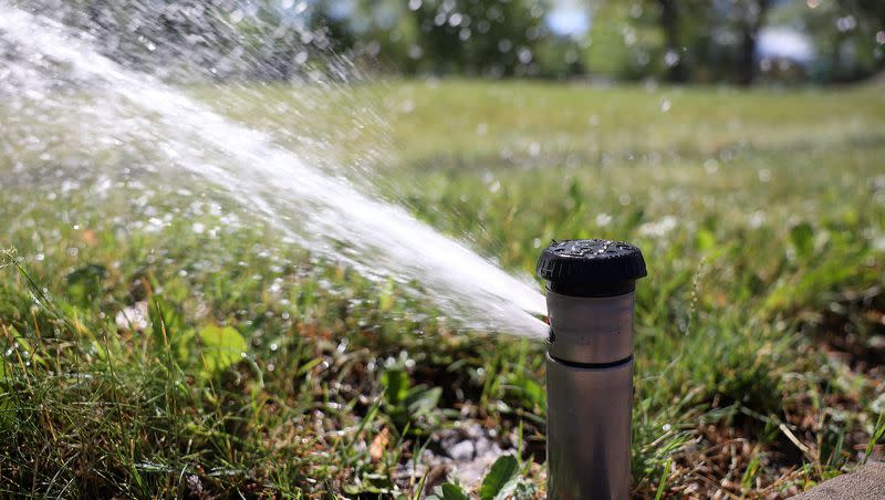 A sprinkler runs at Liberty Park in Salt Lake City on Thursday, July 7, 2022. A resolution before the Utah Legislature urges communities to adopt water efficiency standards for new construction.