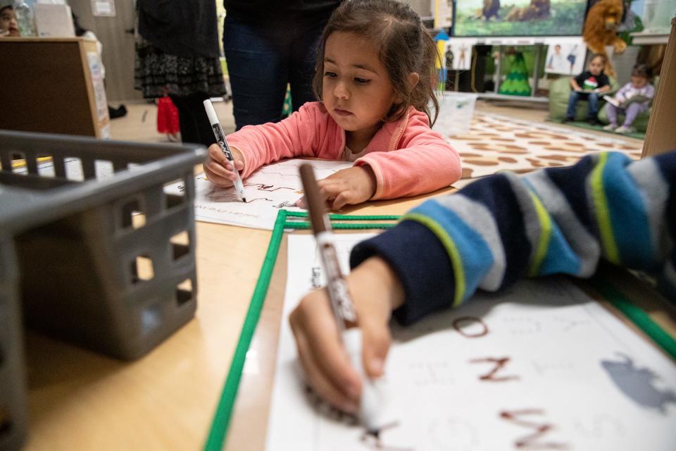 Three-year-old pre-K student Eva Garcia traces letters while learning how to write at Menger Elementary School on Wednesday, Dec. 21, 2022, in Corpus Christi, Texas.