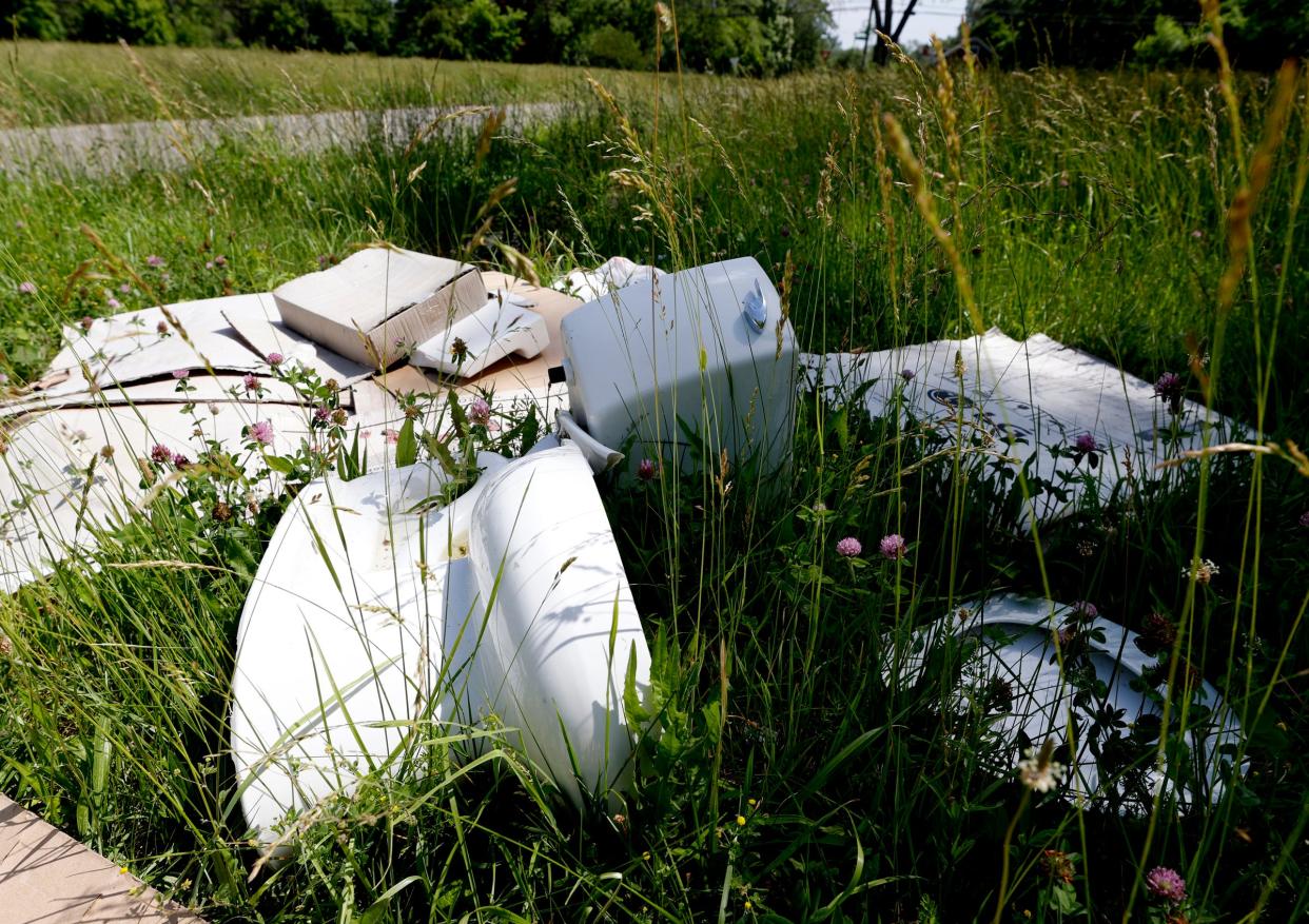 Tires and other debris dumped in the Brightmoor neighborhood of Detroit in June 2022. A new grant program by the state of Michigan is aimed at helping reduce the amount of scrap tires by paying for their removal.