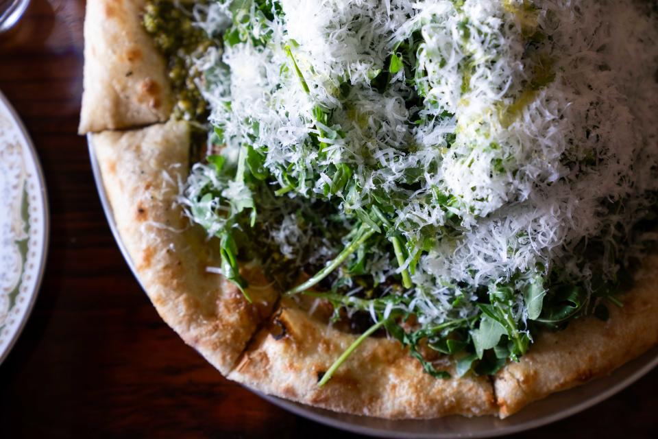 The Greens pizza comes with pistachio pesto, arugula and parmigiana reggiano at Ciderhouse Restaurant at Wilson's Orchard in Cumming.