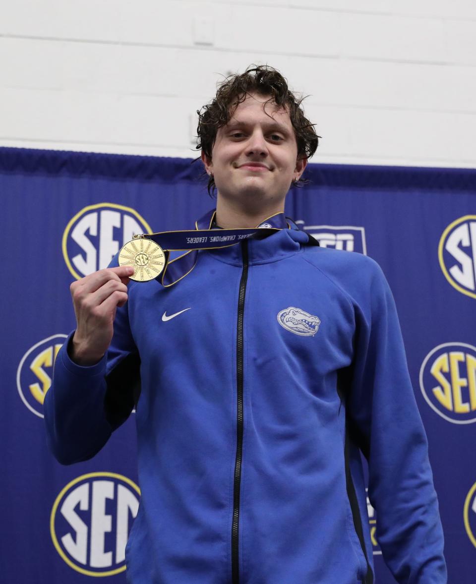 University of Florida freshman Jonny Marshall smiles atop the podium in the SEC Championship meet on Saturday, February 24, 2024 at James E. Martin Aquatic Center in Auburn, Ala.