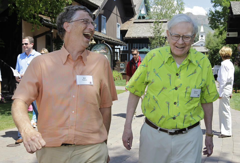 Billionaire investor Warren Buffett, right, and Microsoft Chairman and co-founder Bill Gates, left, at the Allen & Company Sun Valley Conference in Sun Valley, Idaho, Thursday, July 12, 2012. (AP Photo/Paul Sakuma)