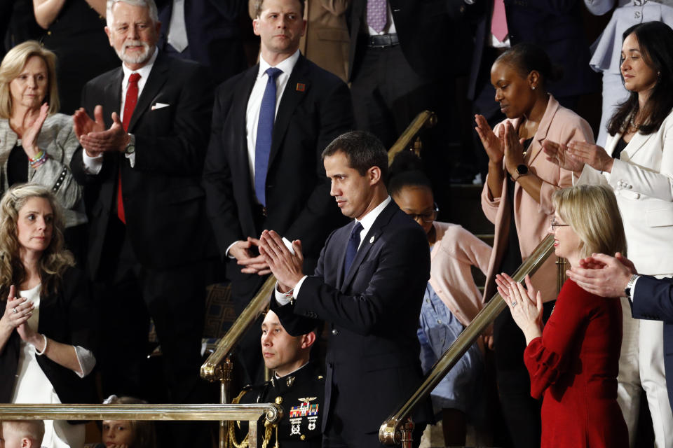 Venezuelan opposition leader Juan Guaido applauds as President Donald Trump delivers his State of the Union address to a joint session of Congress on Capitol Hill in Washington, Tuesday, Feb. 4, 2020. (AP Photo/Patrick Semansky)