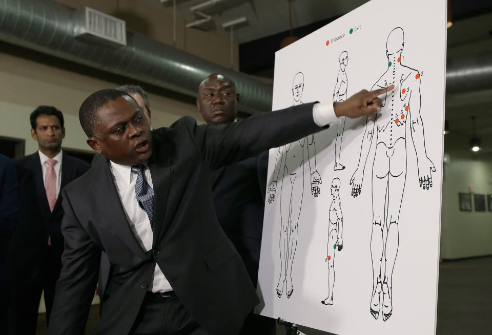 <p>Pathologist Dr. Bennet Omalu points to details in a diagram showing the gunshot wounds he found on the body of Stephon Clark who was shot by Sacramento police, during a news conference Friday, March 30, 2018, in Sacramento, Calif. Omalu was hired by the attorneys of the Clark family to perform the independent autopsy. (Photo: Rich Pedroncelli/AP) </p>