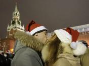 Revellers kiss as they celebrate ahead of New Year's Day in Red Square in Moscow December 31, 2012.