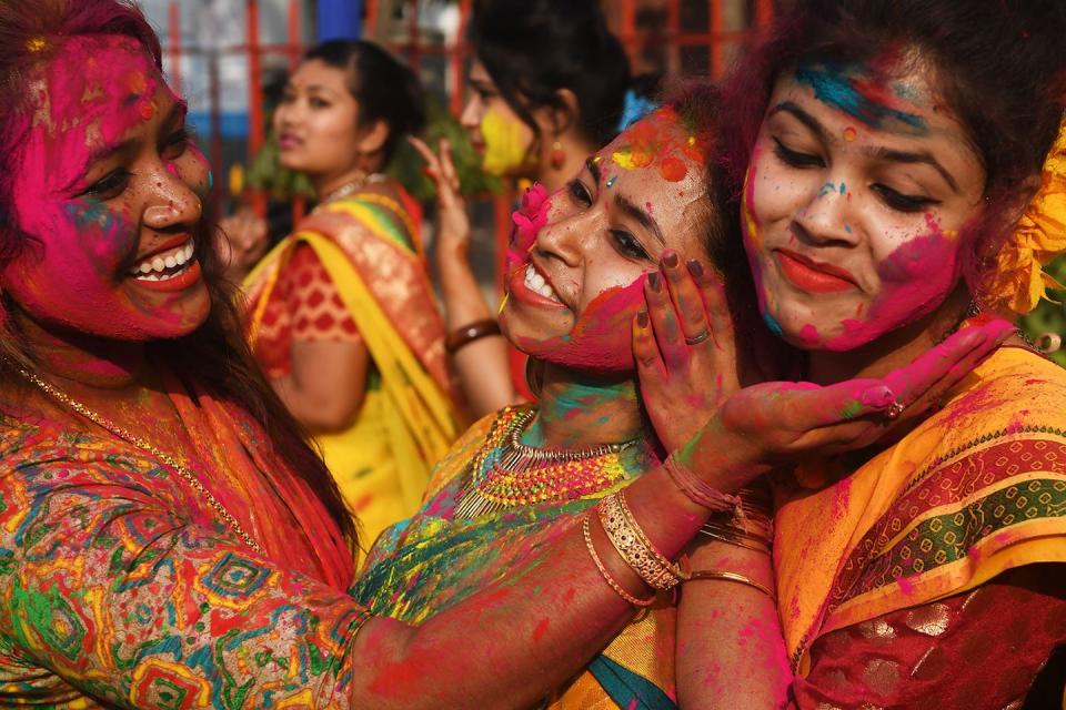 <p>Indian students celebrate the festival of Holi in Kolkata with multicolored powder on February 26, 2018. Holi is the popular Hindu spring festival of colors observed at the end of the winter season on the last full moon of the lunar month, and was celebrated on March 1 this year.</p>