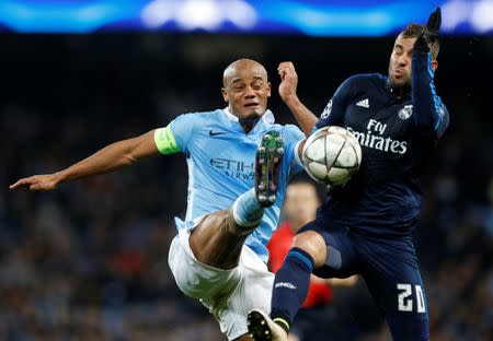 Football Soccer - Manchester City v Real Madrid - UEFA Champions League Semi Final First Leg - Etihad Stadium, Manchester, England - 26/4/16 Manchester City's Vincent Kompany in action with Real Madrid's Jese Action Images via Reuters / Carl Recine Livepic