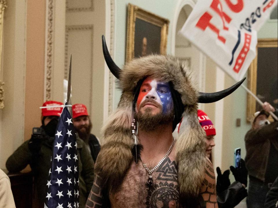 Jacob Chansley, the ‘QAnon Shaman’, in the US Capitol on 6 January 2021 (AFP/Getty)