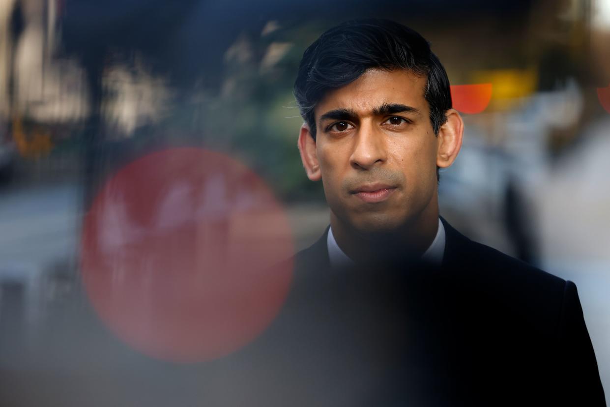 Britain's Chancellor of the Exchequer Rishi Sunak reacts during a media interview after arriving at the BBC in central London on November 22, 2020, to take appear on the BBC political programme The Andrew Marr Show. - Britain's debt is now at its highest level since 1961 as a share of GDP, after the government embarked on a massive spending spree to mitigate the economic effects of the COVID-19 coronavirus pandemic and resulting lockdowns. (Photo by Tolga Akmen / AFP) (Photo by TOLGA AKMEN/AFP via Getty Images)