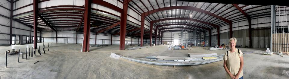 Lori Colon stands in the large Playlab area that will hold many interactive displays.