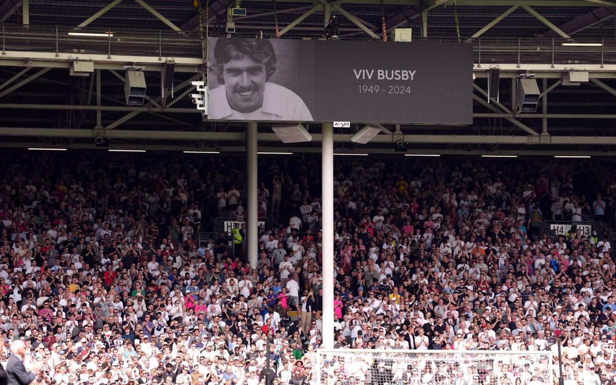 A general view of a minutes applause for Viv Busby during the Premier League match at Craven Cottage