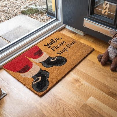 This welcoming Santa Claus doormat