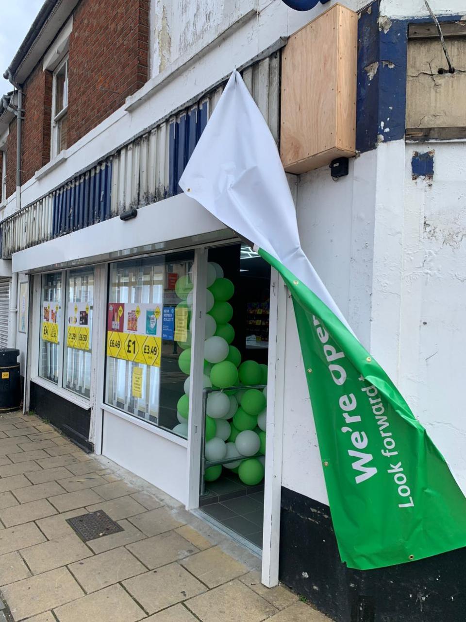 Swindon Advertiser: The balloon arch and banner, which has fallen down