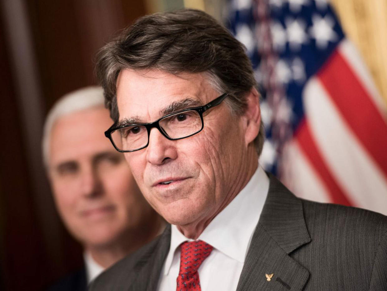 The United States should stay in the Paris climate accord but renegotiate it, Mr Perry said: AFP