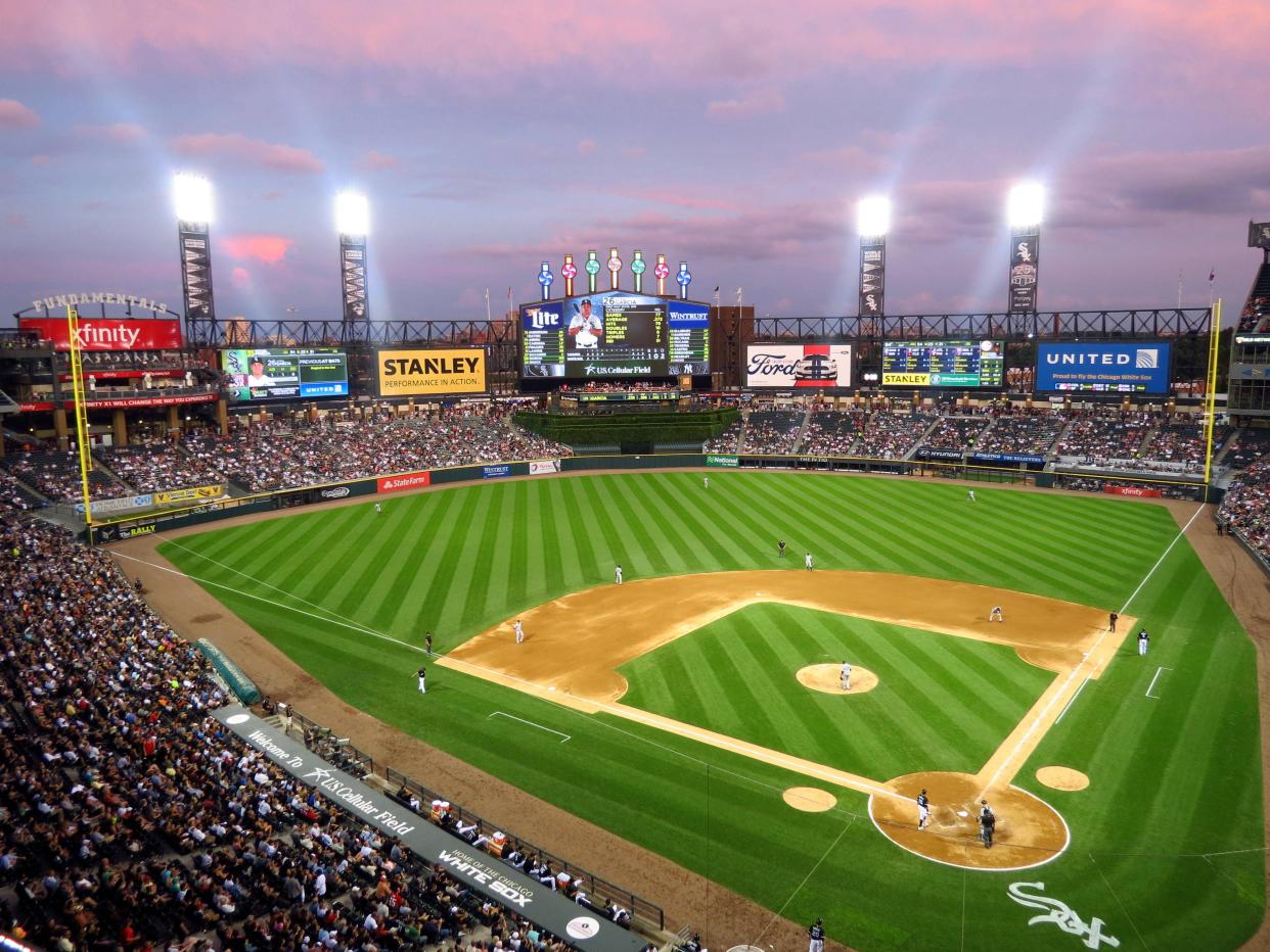 View of the field from upper level seating, Guaranteed Rate Field, Chicago, home of the Chicago White Sox during sunset with lights on