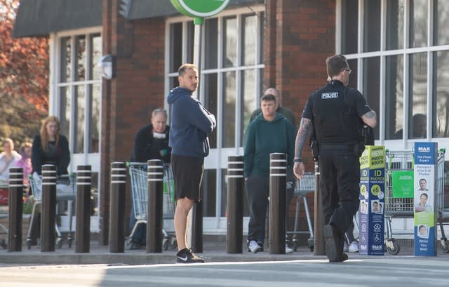 Shoppers outside an Asda store 