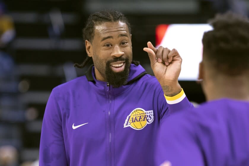 Los Angeles Lakers center DeAndre Jordan gestures to a teammate.