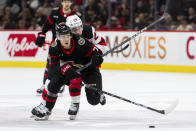 New Jersey Devils right wing Timo Meier (28) and Ottawa Senators centre Ridly Greig (71) vie for control of the puck during first-period NHL hockey game action in Ottawa, Ontario, Saturday, April 6, 2024. (Spencer Colby/The Canadian Press via AP)