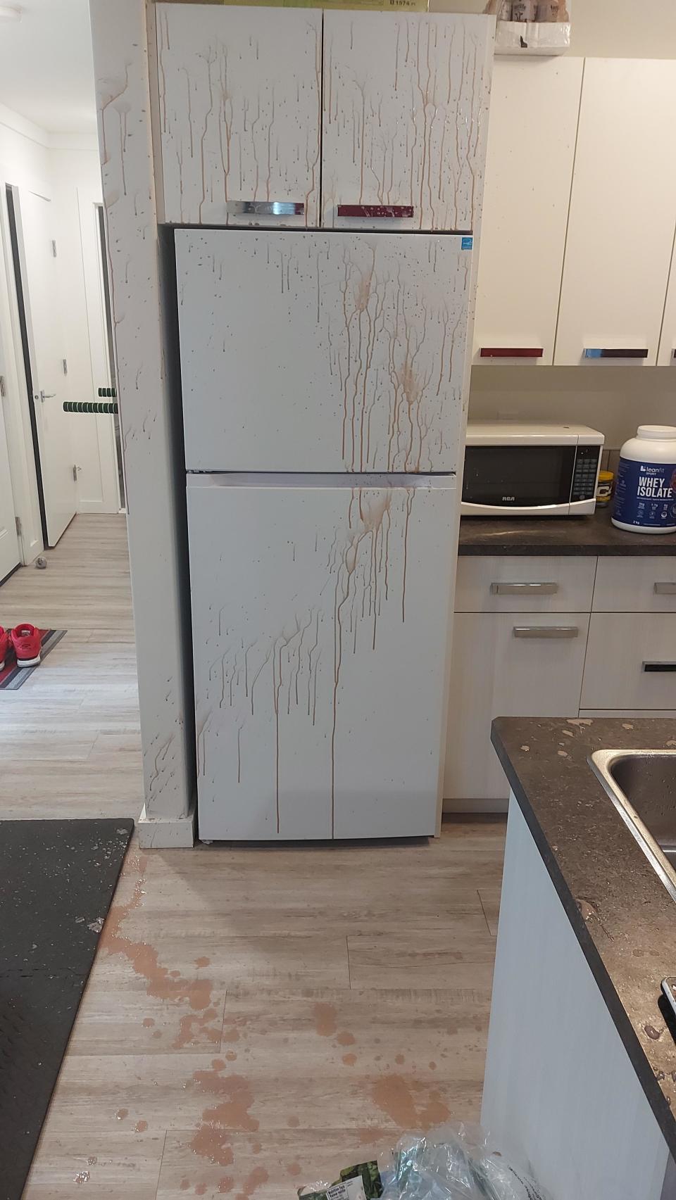 shake splattered all over the floor and fridge