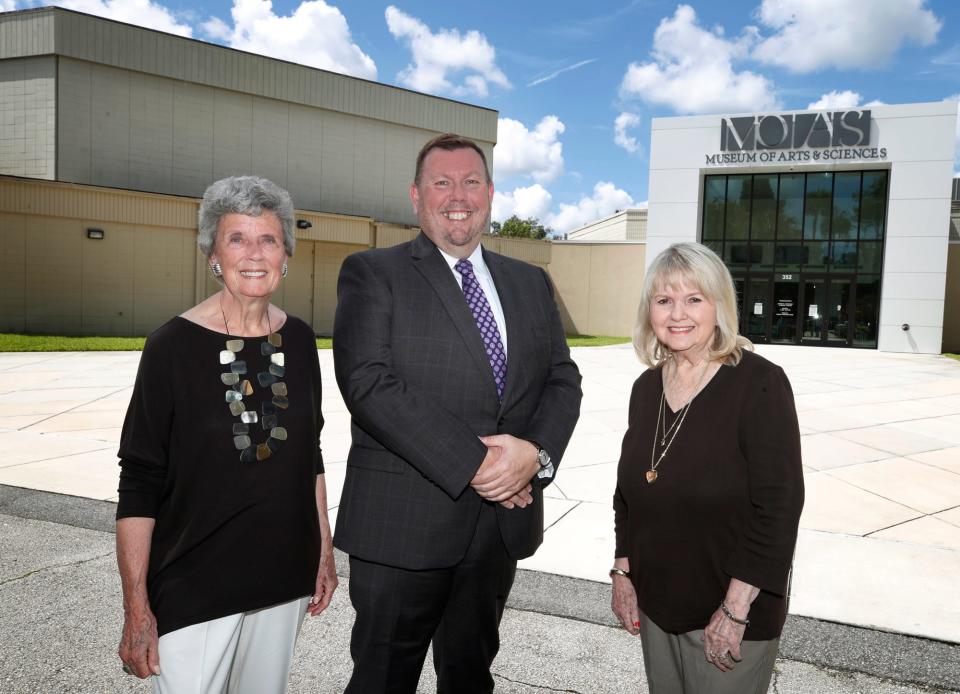 Daytona Beach's Museum of Arts & Sciences escaped major damage from Tropical Storm Ian, but the structure is closed while minor repairs and cleanup are taken care of. Pictured in front of the museum last year are longtime museum board member Cici Brown, former museum executive director Andrew Sandall and Leila Gosney.