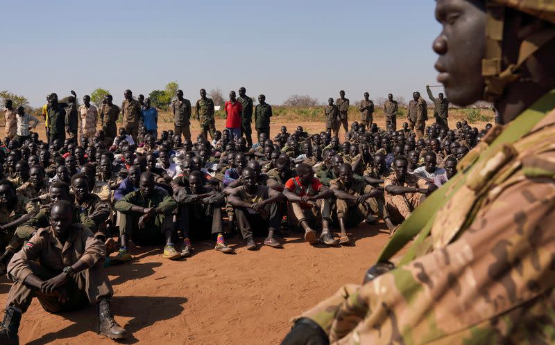 South Sudan soldiers gather at the training site for the joint force to protect VIPs in Gorom outside Juba