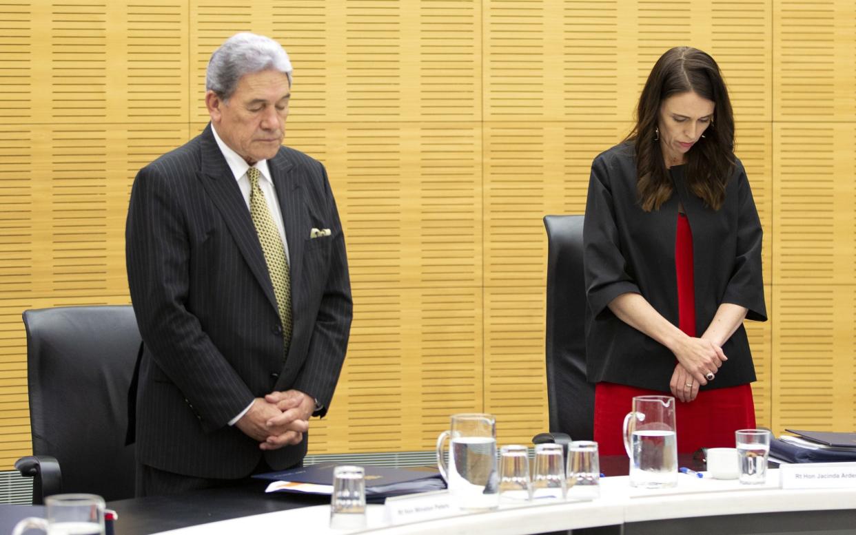 Prime Minister Jacinda Ardern and deputy Winston Peters observe a minute of silence for victims - Getty Images AsiaPac