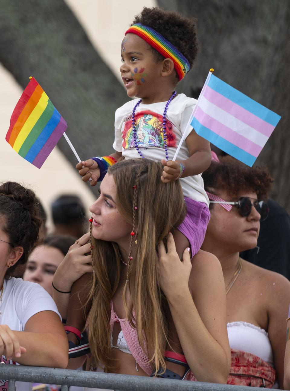 Parade-goers watch the St. Pete Pride Parade along Bayshore Drive on Saturday, June 24, 2023, in St. Petersburg, Fla. (Chloe Trofatter/Tampa Bay Times via AP)