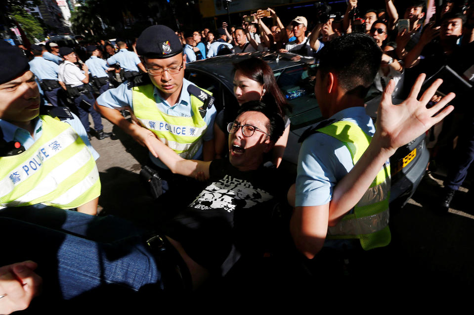 <p>Pro-democracy activist Avery Ng is detained by police as he takes part in a protest demanding the release of Chinese Nobel rights activist Liu Xiaobo, during Chinese President Xi Jinping’s visit in Hong Kong, China, July 1, 2017. (Photo: Tyrone Siu/Reuters) </p>