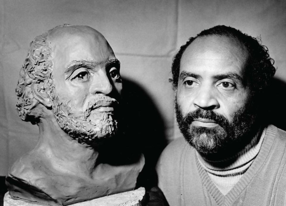 Morris Baker with a bust of Paul Robeson, whom he portrayed on stage in 1984 - more than 20 years after Baker was the first Black graduate of McMurry College, Robeson was an American bass-baritone concert artist, stage and film actor, and football player.