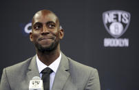 FILE - In this July 18, 2013 file photo, Kevin Garnett smiles as he speaks to reporters during an NBA basketball news conference in New York. Garnett and fellow NBA greats Tim Duncan and Kobe Bryant headlined a nine-person group announced Saturday, April 4, 2020, as this year’s class of enshrinees into the Naismith Memorial Basketball Hall of Fame. They all got into the Hall in their first year of eligibility, as did WNBA great Tamika Catchings. Two-time NBA champion coach Rudy Tomjanovich, longtime Baylor women’s coach Kim Mulkey, 1,000-game winner Barbara Stevens of Bentley and three-time Final Four coach Eddie Sutton were selected. So was former FIBA Secretary General Patrick Baumann. (AP Photo/Mary Altaffer, File)