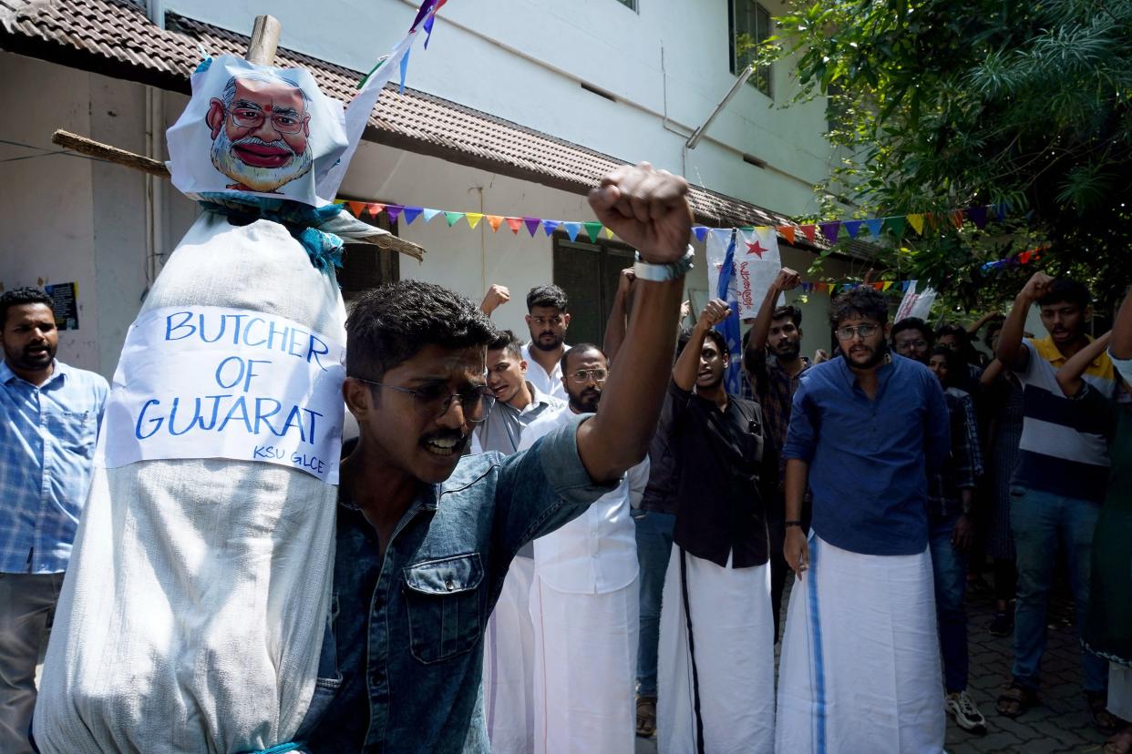 Student activists in Kochi, India, with an effigy of Prime Minister Narendra Modi labeled: Butcher of Gujarat.