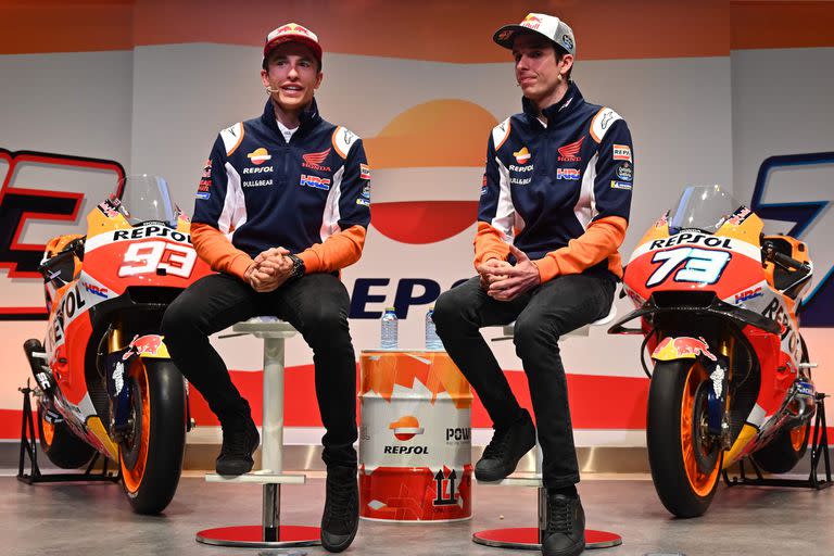 In this file photo taken on February 27, 2020 Repsol Honda Teams Spanish MotoGP driver Marc Marquez and his brother teammate Alex (R) attend the presentation of the new Repsol Honda team in Madrid. - Motorcycling is often a family affair, and yet before Alex Marquez joined Marc at Honda for this sea