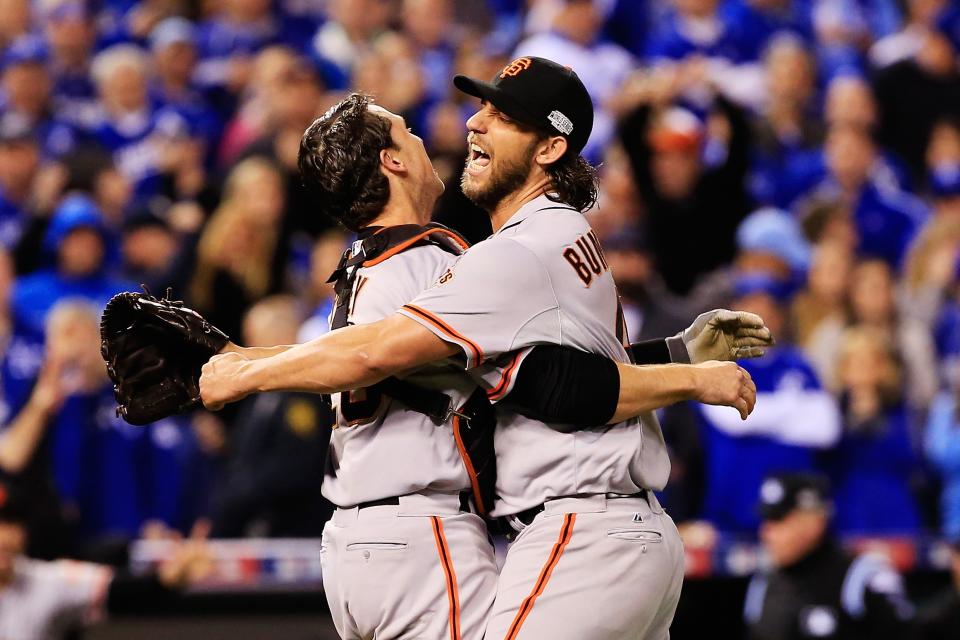 Buster Posey and Madison Bumgarner celebrate winning Game 7 of the 2014 World Series. (Jamie Squire/Getty Images)