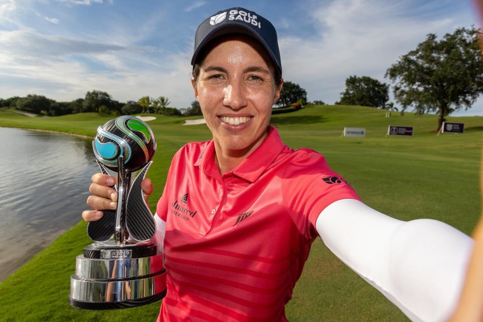 Carlota Ciganda of Spain with her trophy after winning the individual title Sunday at Trump International.