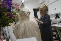 Elizabeth Emanuel, who designed Diana, Princess of Wales wedding dress, speaks at her studio during an interview with the Associated Press in Maida Vale, London, Monday, Aug. 22, 2022. (AP Photo/Alastair Grant)
