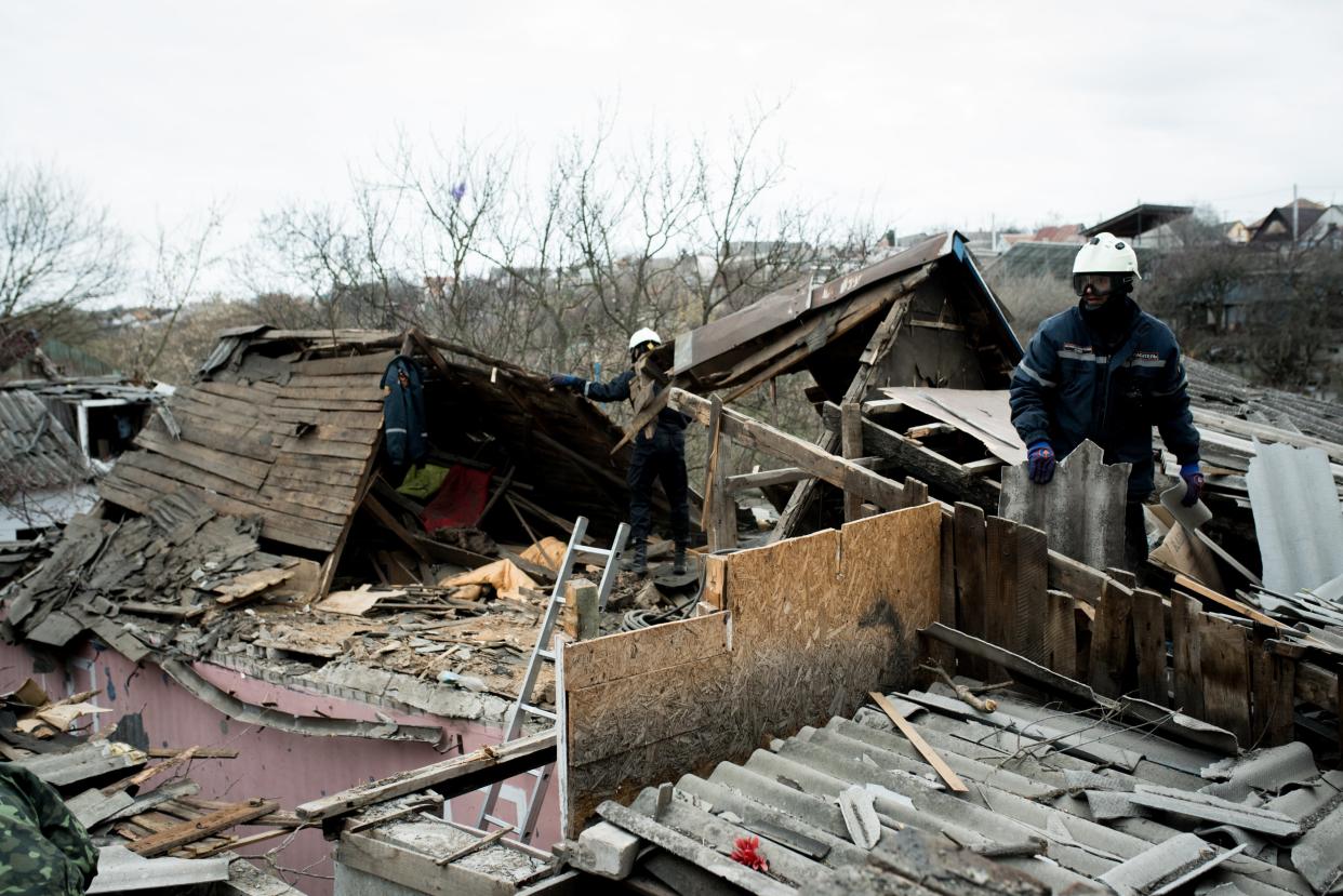 Rescuers work at a residential building damaged by the blast wave after a missile attack on March 31, 2023 in Zaporizhzhia, Ukraine (Global Images Ukraine via Getty)