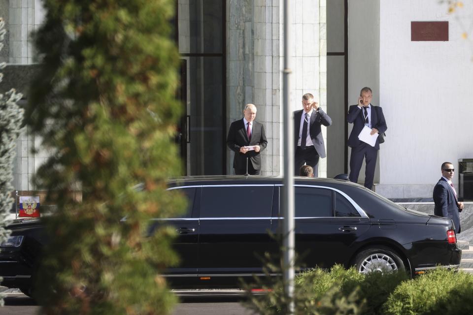 Russian President Vladimir Putin, center, arrives to attend a welcome ceremony with Kyrgyzstan's President Sadyr Japarov prior to their talks in Bishkek, Kyrgyzstan, Thursday, Oct. 12, 2023. (Sergei Karpukhin, Sputnik, Kremlin Pool Photo via AP)