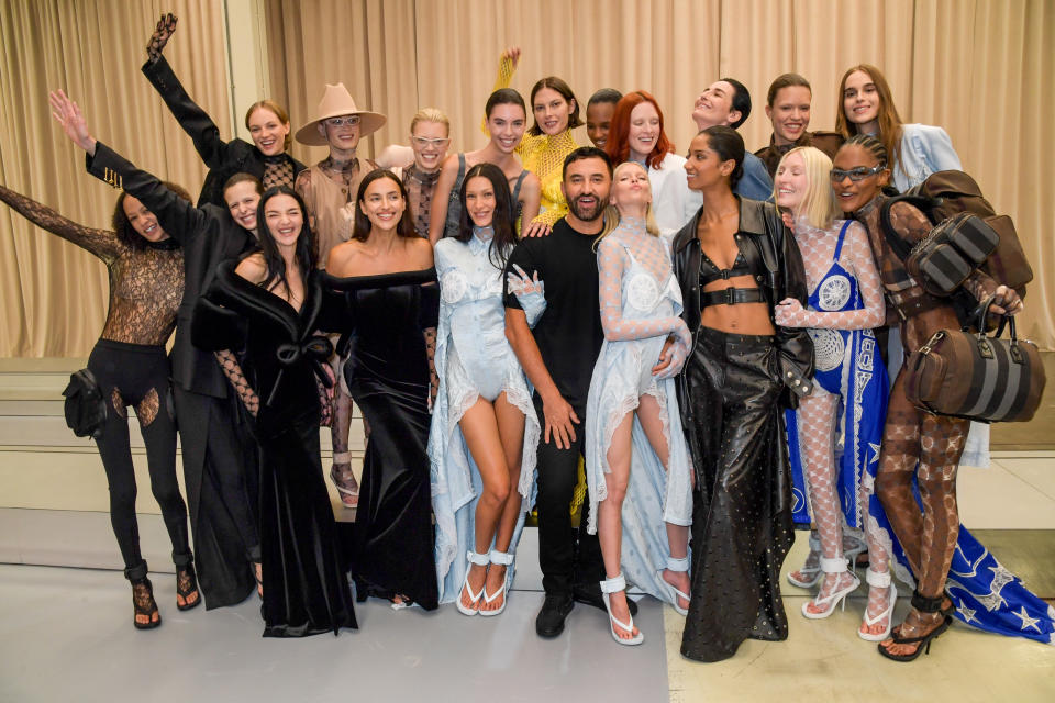 LONDON, ENGLAND - SEPTEMBER 26: (C) CCO of Burberry Riccardo Tisci poses backstage with models including Fran Summers, Mariacarla Boscono, Irina Shayk, Candice Shepstone, Bella Hadid, Stella Maxwell, Erin O'Connor and Ella Richards at the Burberry Spring/Summer 2023 runway show in Bermondsey on September 26, 2022 in London, England. (Photo by David M. Benett/Dave Benett/Getty Images for Burberry)