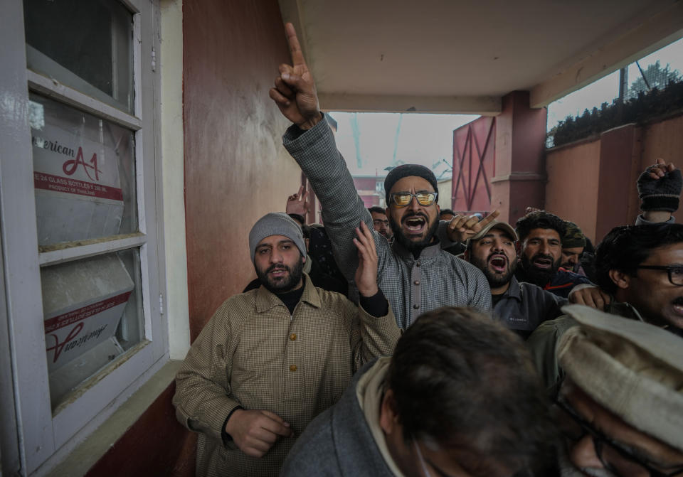 Supporters of Jammu Kashmir National Conference shout slogans during a protest in Srinagar, Indian controlled Kashmir,Tuesday, Dec 23, 2023. Anger spread in some remote parts of Indian-controlled Kashmir after three civilians were killed while in army custody, officials and residents said Saturday. This comes two days after a militant ambush killed four soldiers. (AP Photo/Mukhtar Khan)