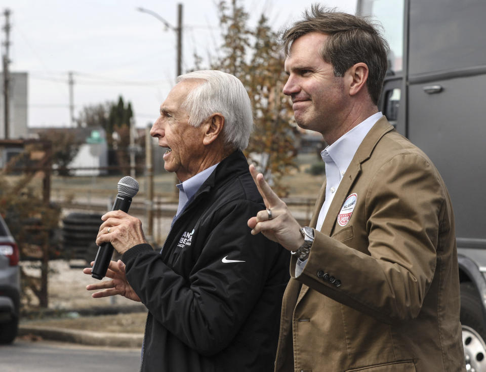 Kentucky Governor and Democratic candidate for re-election Andy Beshear, right, is introduced to supporters by his father, former Kentucky Governor Steve Beshear, during a campaign stop, Saturday, Nov. 4, 2023, in Owensboro, Ky. (Greg Eans/The Messenger-Inquirer via AP)