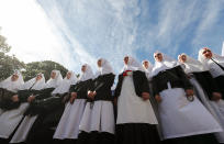 <p>Believers of the Ukrainian Orthodox Church of Moscow Patriarchate pray during their rally near of Parliament building in Kiev, Ukraine, May 18, 2017. Orthodox believers of Moscow Patriarchate protest against adopting of the law drafts N4511 and N4128 by Ukrainian parliament about special status of religion?s organizations with guidance centers placed in country, recognized as aggressor by Ukrainian Parliament for defending of Ukrainian interests. (Photo: Sergey Dolzhenko/EPA) </p>