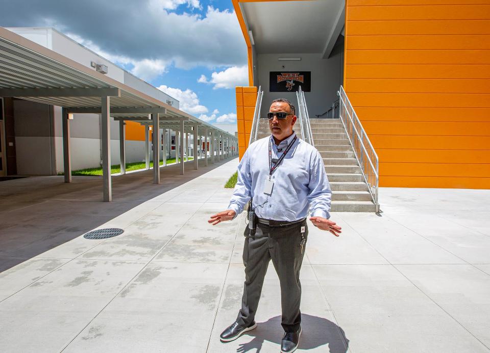 Joe Peccia, principal of West Boynton Beach Middle School, leads a tour of the new school Monday.